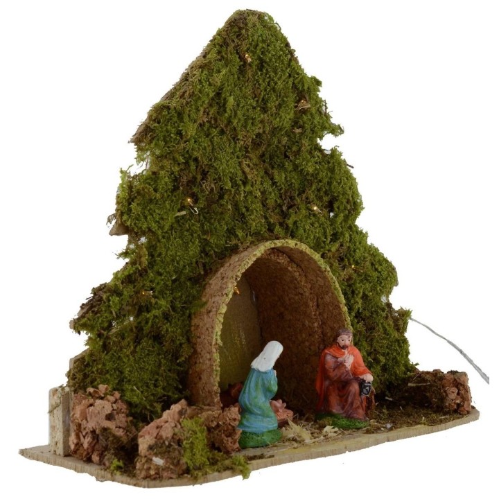 Tree with hut and Nativity illuminated with piled with