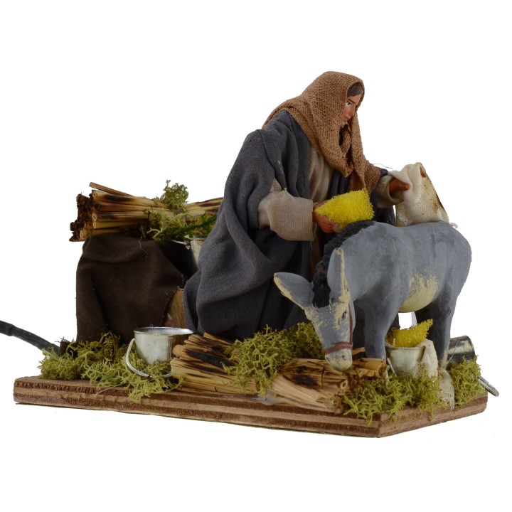 Hombre que cepilla burro en movimiento serie 12 cm