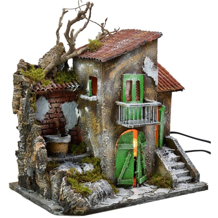 Casa iluminada con fuente funcionando de 30x21x35 cm h