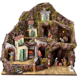 Illuminated nativity scene complete with Landi statues with fountain, fire