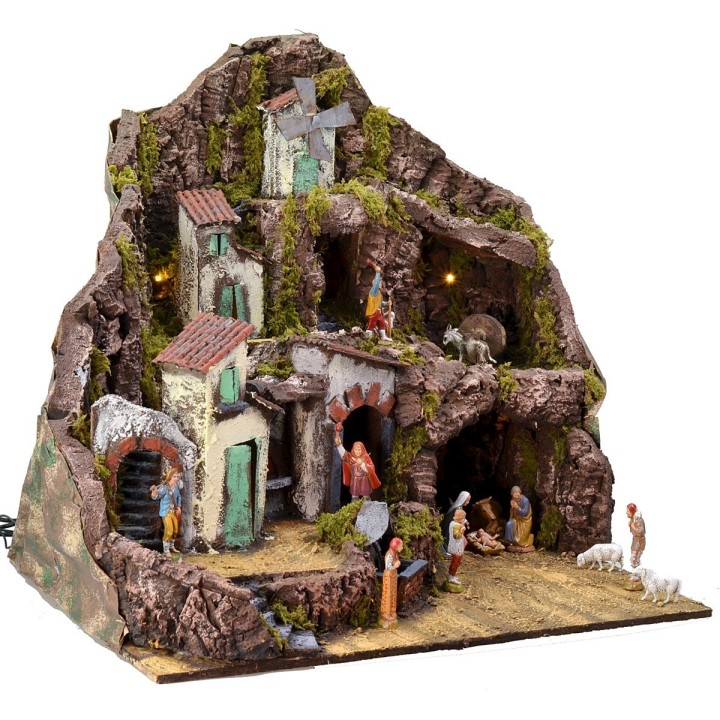 Illuminated nativity scene complete with Landi statues with fountain, fire