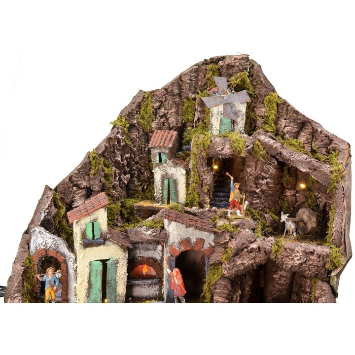 Illuminated nativity scene complete with Landi statues with fountain, fire