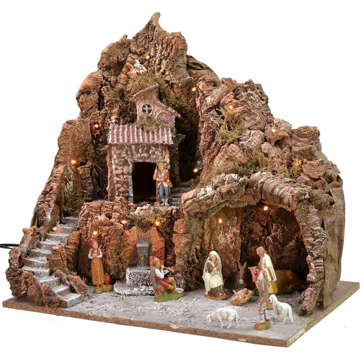 Illuminated nativity scene complete with Landi statues with fountain