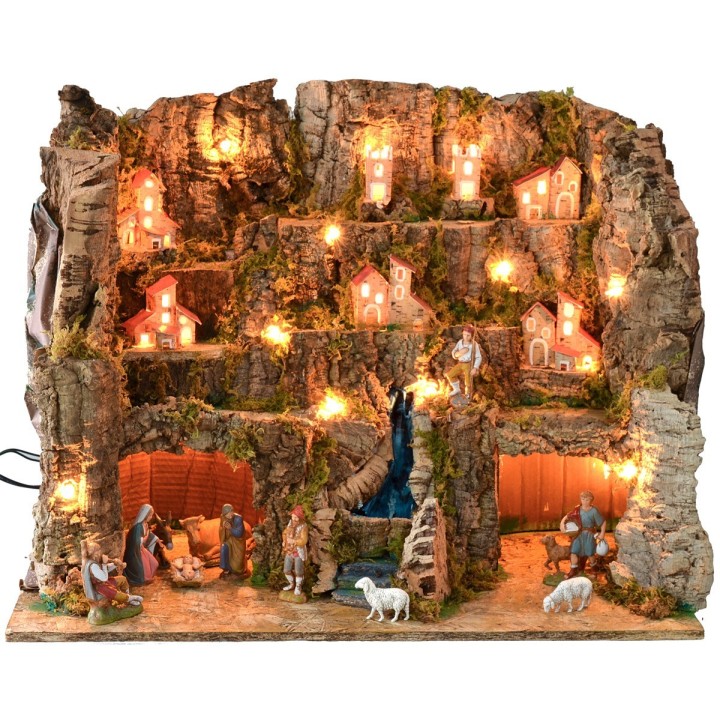 Illuminated nativity scene complete with Landi statues with landscape and