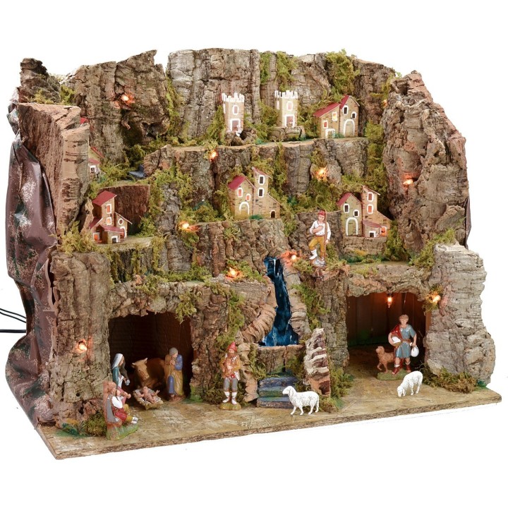 Illuminated nativity scene complete with Landi statues with landscape and