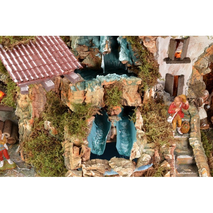 Illuminated nativity scene complete with Landi statues and double waterfall