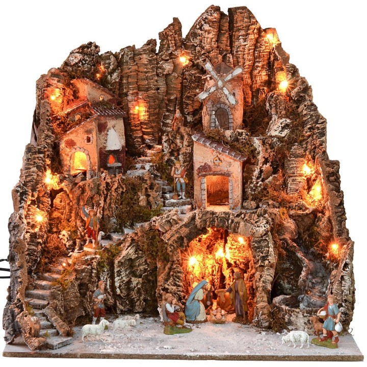 Illuminated nativity scene complete with Landi statues and windmill
