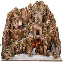 Illuminated nativity scene complete with Landi statues and windmill