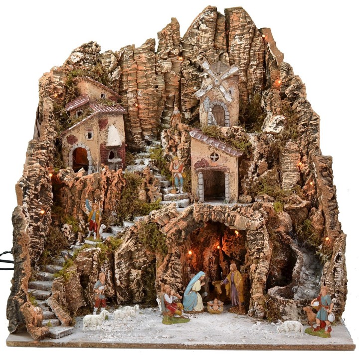 Illuminated nativity scene complete with Landi statues and windmill