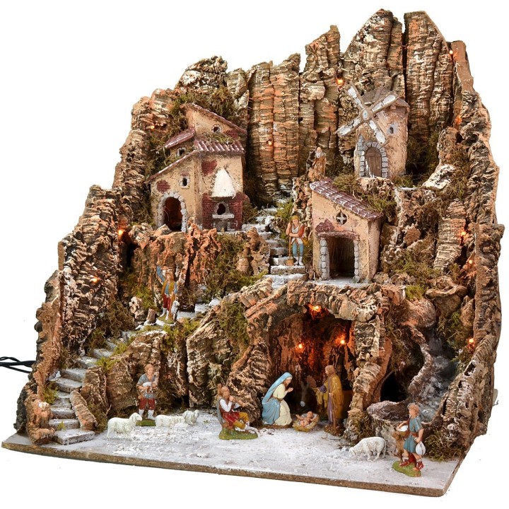 Illuminated nativity scene complete with Landi statues and windmill