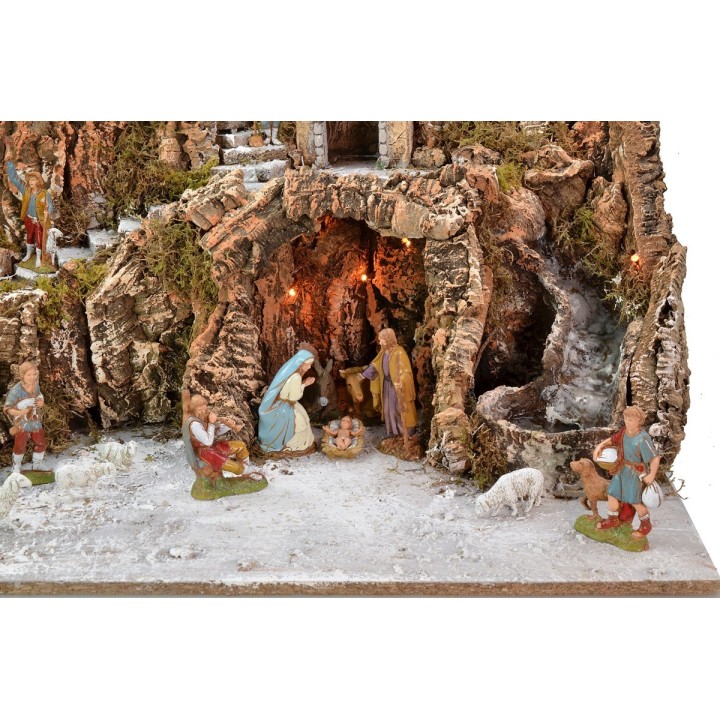 Illuminated nativity scene complete with Landi statues and windmill