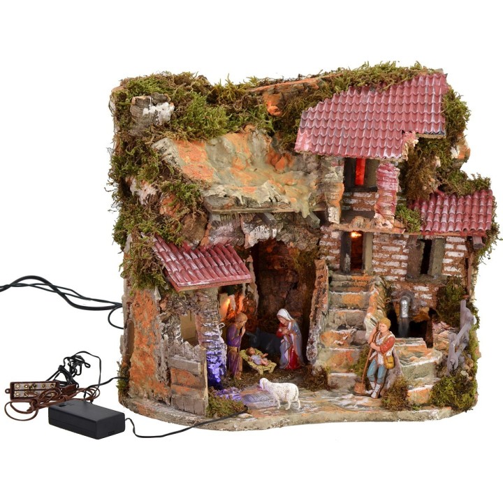 Illuminated nativity scene complete with Landi statues and fountain