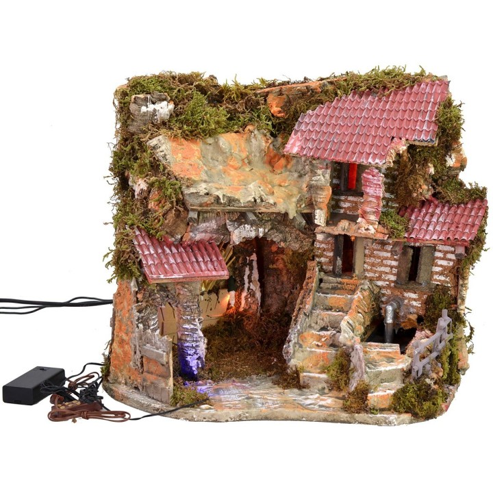 Illuminated nativity scene with working fountain and night effect