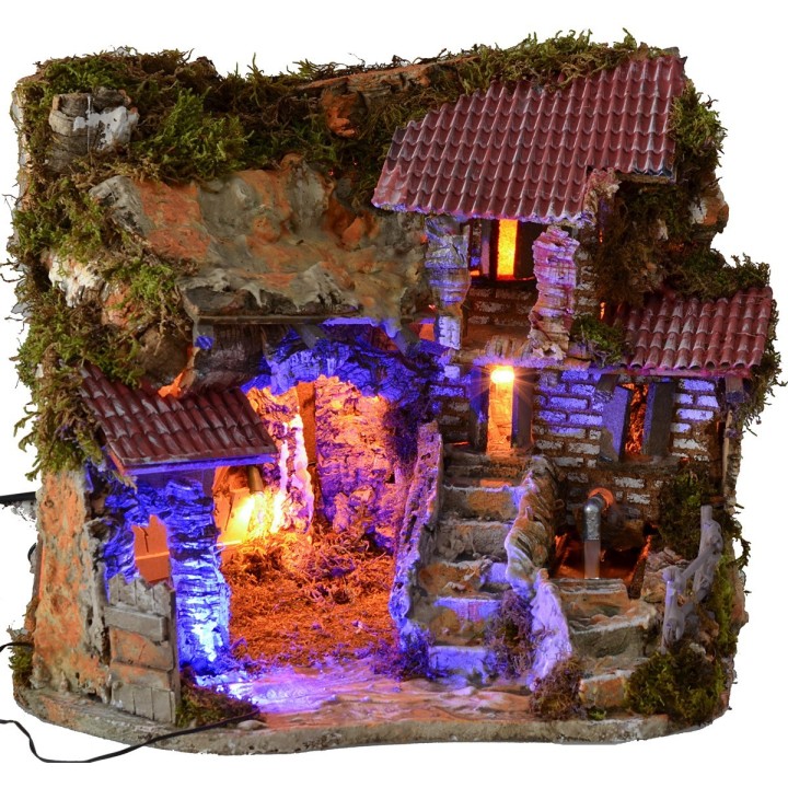 Illuminated nativity scene with working fountain and night effect