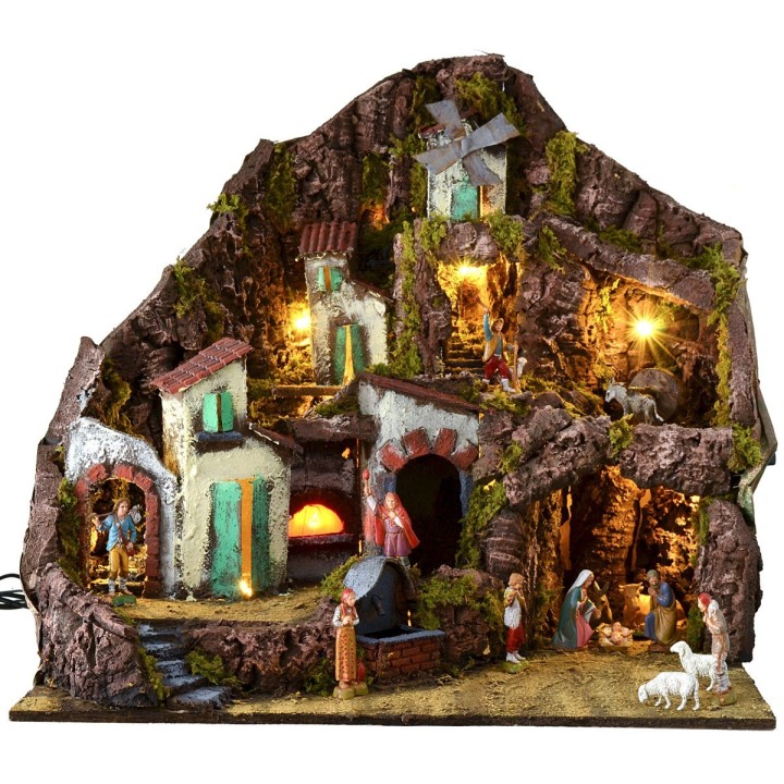Illuminated nativity scene complete with Landi statues with fountain, fire