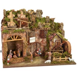 Illuminated nativity scene complete with Landi statues and water mill