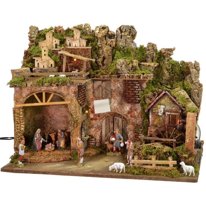 Illuminated nativity scene complete with Landi statues and water mill