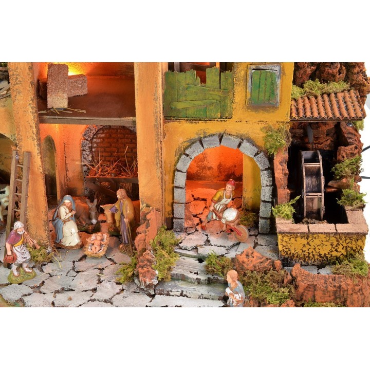 Illuminated nativity scene complete with Landi statues and water mill