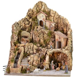 Illuminated nativity scene with donkey at the mill complete with statues