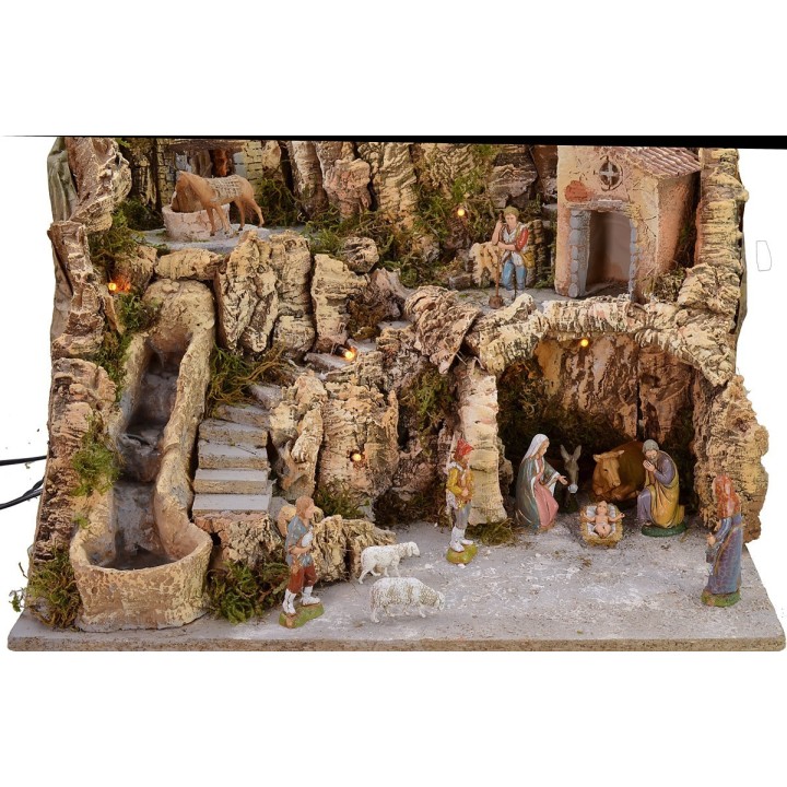 Illuminated nativity scene with donkey at the mill complete with statues