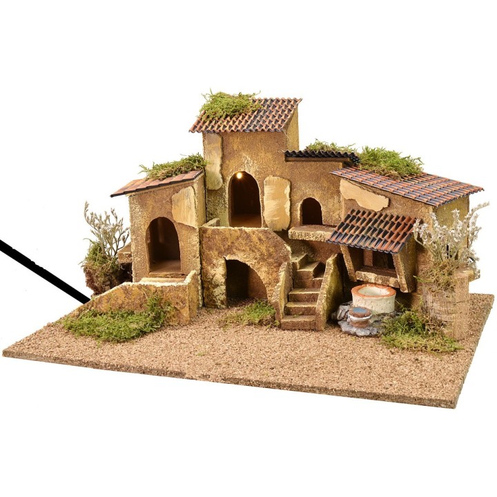 Grupo de casas con pozo iluminadas por corriente de 47x32x24,5
