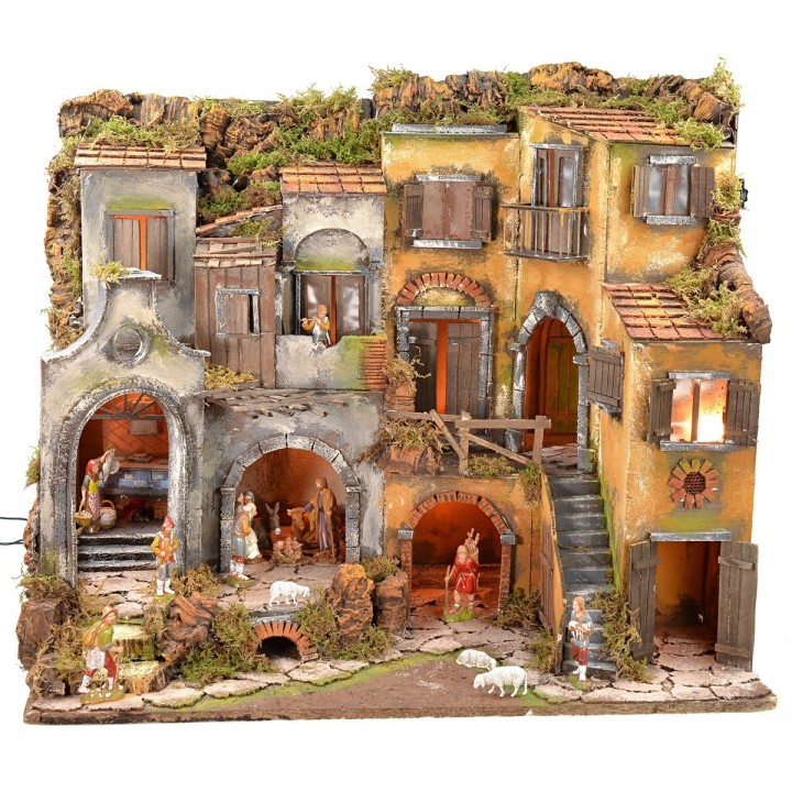 Illuminated Neapolitan nativity scene complete with Landi statues