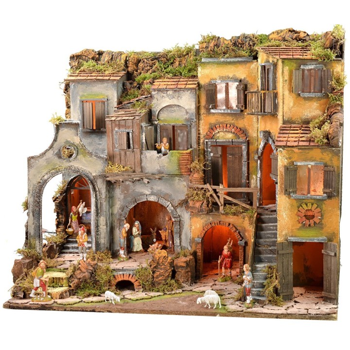 Illuminated Neapolitan nativity scene complete with Landi statues