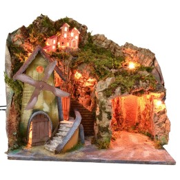Illuminated landscape with cave and working watermill