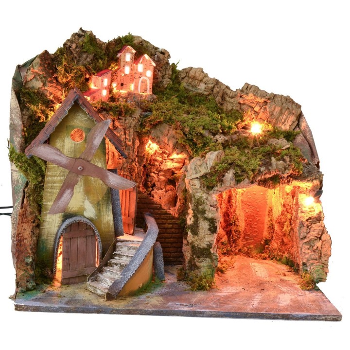 Paisaje iluminado con cueva y molino en funcionamiento a corriente