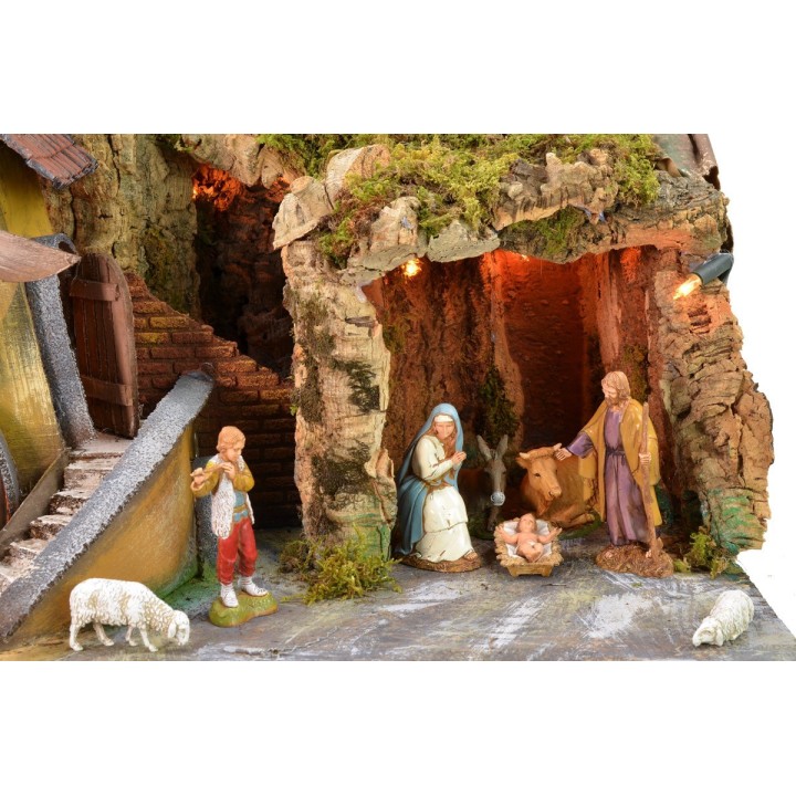 Illuminated nativity scene with cave and working electric mill