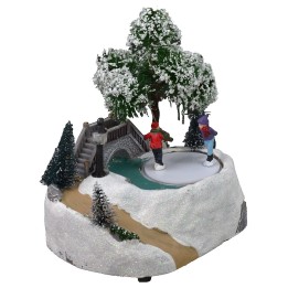 Christmas scenery with bridge and battery-operated skating rink