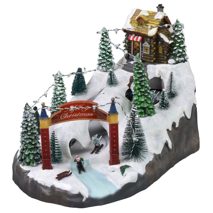 Escenario navideño con pista de esquí funcionando con baterías