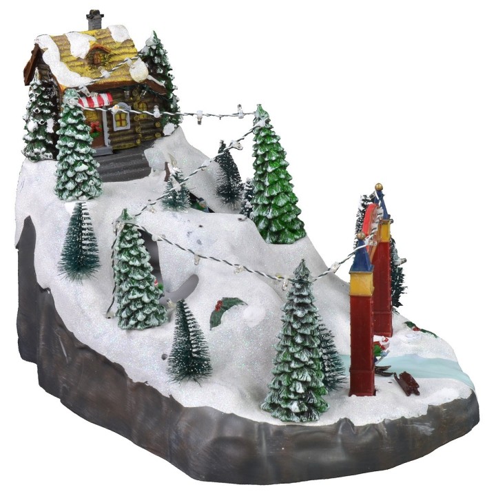 Escenario navideño con pista de esquí funcionando con baterías