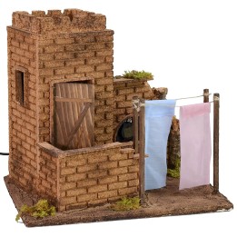 House with clothes hanging wind effect cm 27x19x24,5 h.