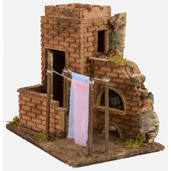 Casa con ropa tendida efecto viento cm 27x19x24,5 h.