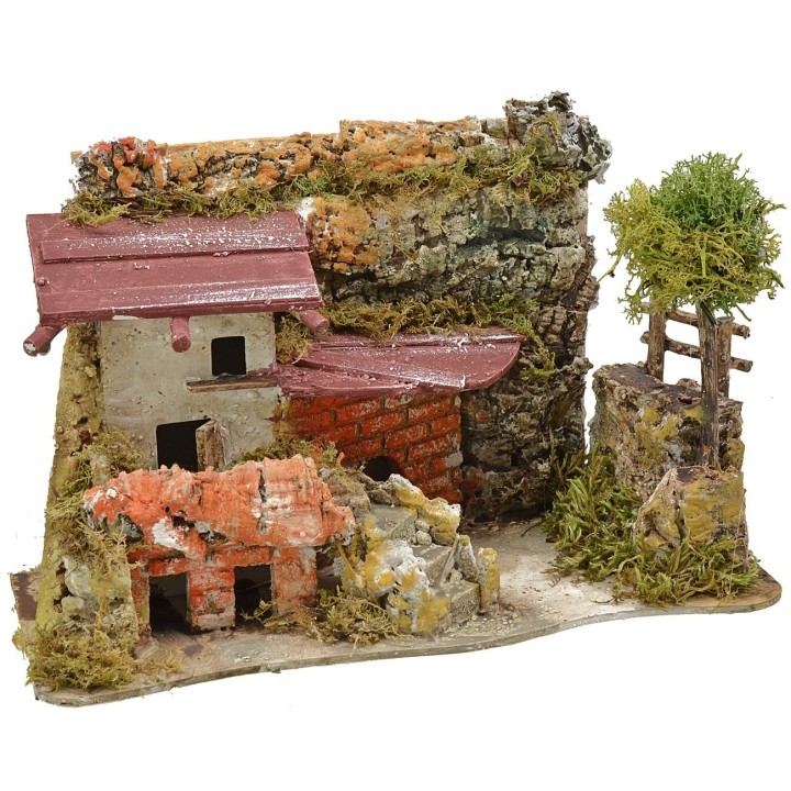Casa estucada con leñera de 27x12x18 cm de altura.