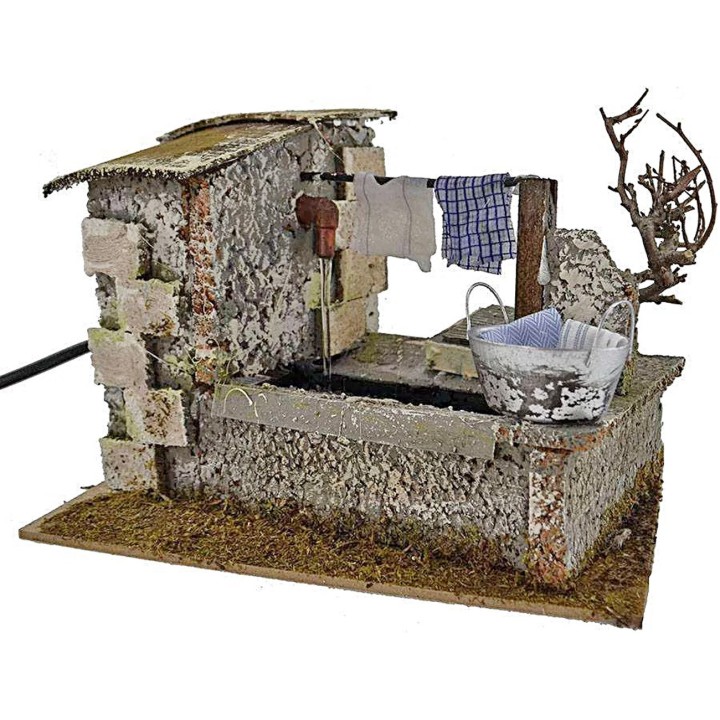 Stenditoio gocciolante con fontana presepe cm 20x14x13 h. 