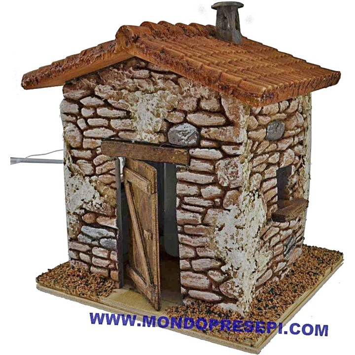 Casa de piedra con humo de 15x12x19 cm de altura.