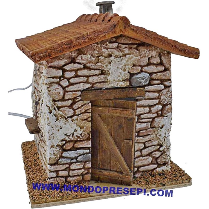 Casa de piedra con humo de 15x12x19 cm de altura.
