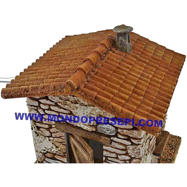 Casa de piedra con humo de 15x12x19 cm de altura.