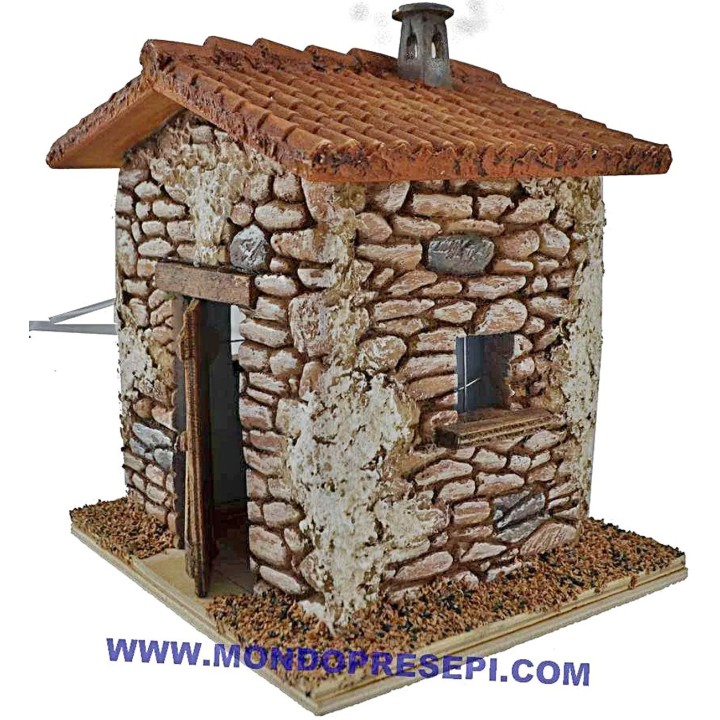Casa de piedra con humo de 15x12x19 cm de altura.