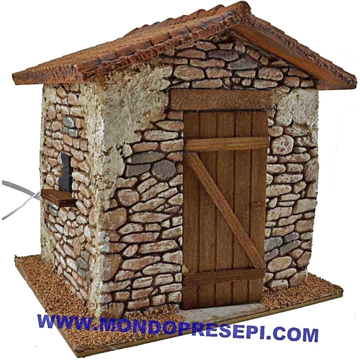 Casa de piedra con humo de 25x22x24 cm de altura.
