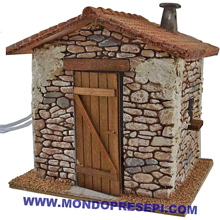Casa de piedra con humo de 25x22x24 cm de altura.
