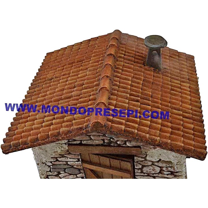 Casa de piedra con humo de 25x22x24 cm de altura.