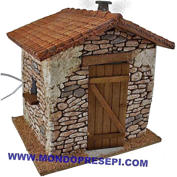 Casa de piedra con humo de 25x22x24 cm de altura.