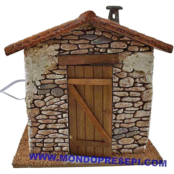 Casa de piedra con humo de 25x22x24 cm de altura.