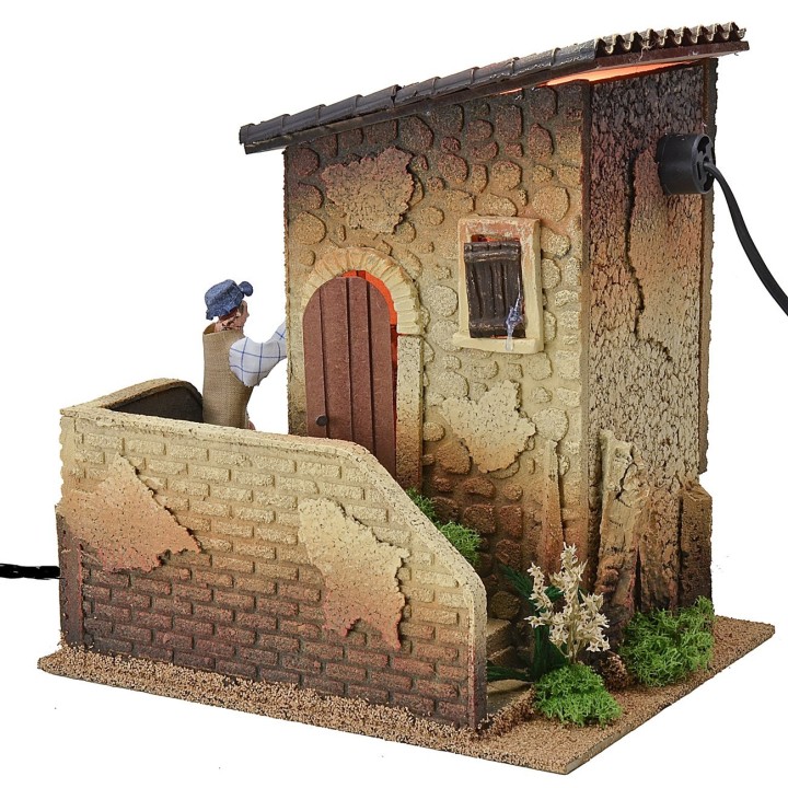 Double movement illuminated house with man ringing the bell and