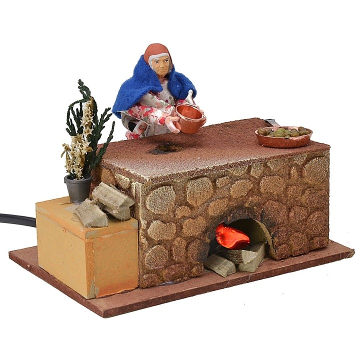 Donna che cucina in movimento 16x10x12 h