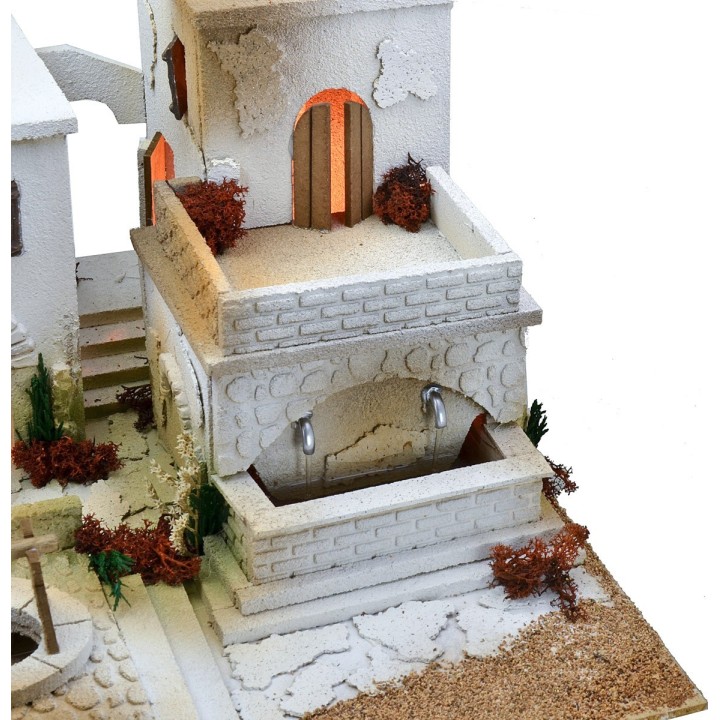 Arab nativity scene with lights, double-tap fountain, and fire
