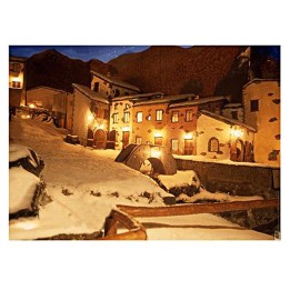 Backdrop with illuminated houses and snowy landscape 70x100 cm